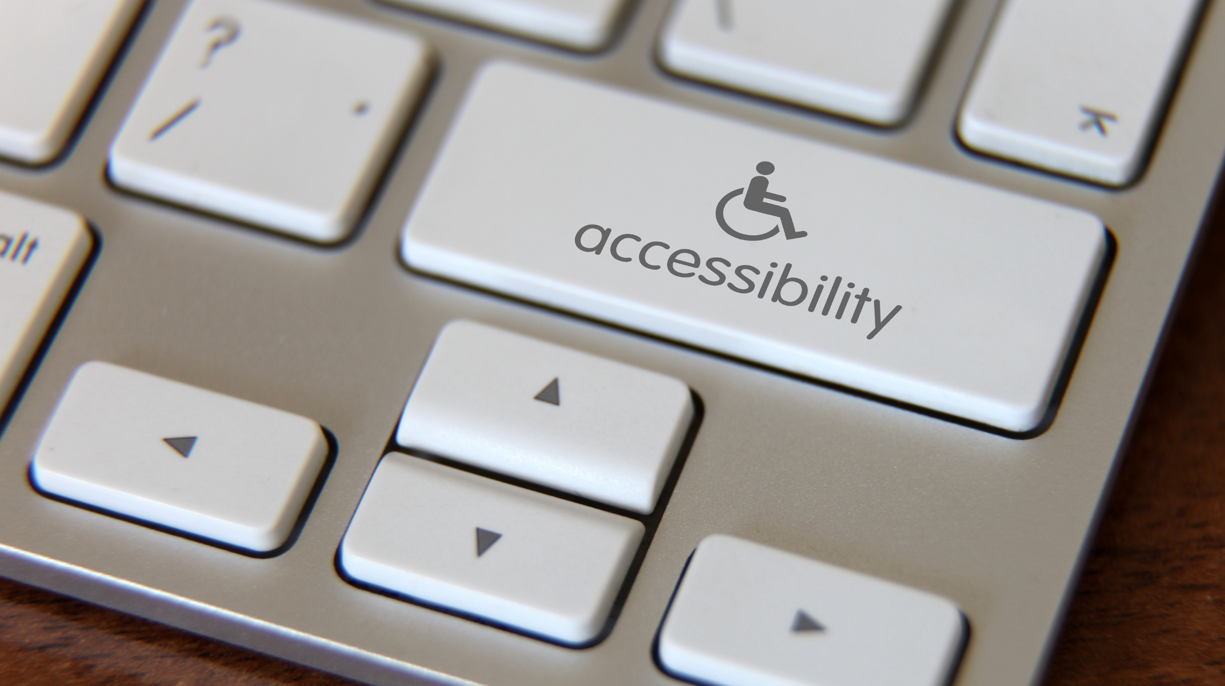 Keyboard key labelled 'accessibility' with a wheelchair icon.
